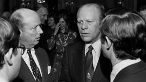 Gerald Ford speaks to three people